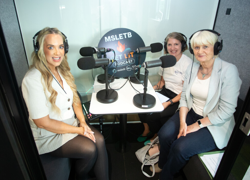 Three women in a podcasting studio